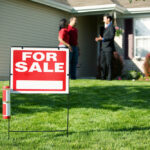 Real,Estate:,For,Sale,Sign,With,Agent,And,Home,Buyer