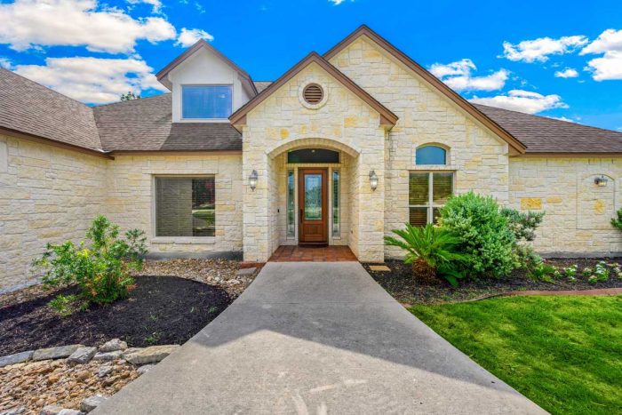 Texas residential home in northern Denton County neighborhood with mature trees and lawn